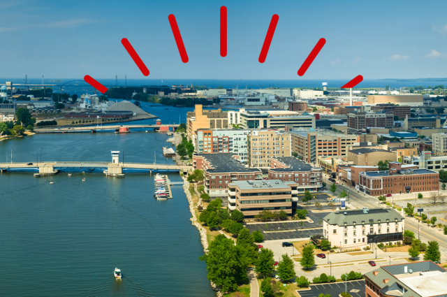 Aerial photo of Green Bay waterfront area on sunny day.